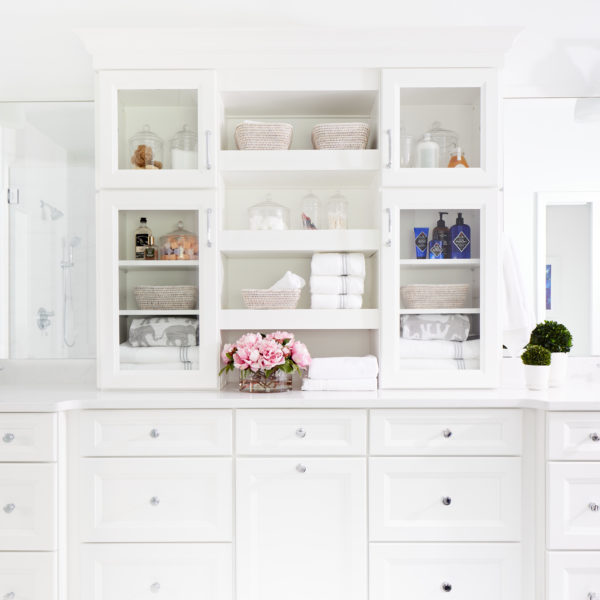 White bathroom with storage cabinets