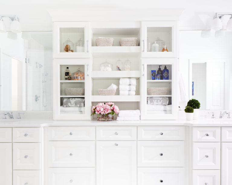 White bathroom with storage cabinets