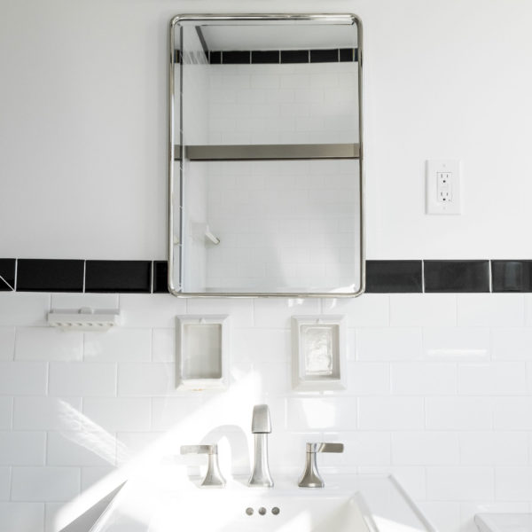 white bathroom sink with black accent