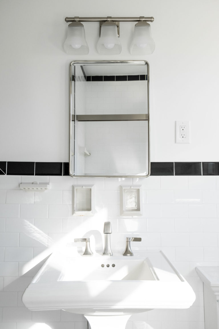 white bathroom sink with black accent