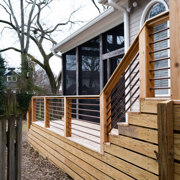 long wood deck at the side of a house