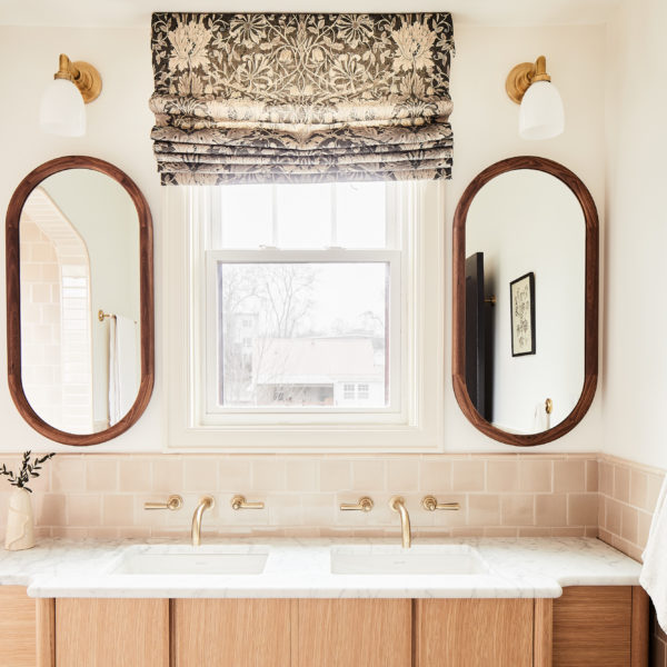 boho bathroom with wood cabinets