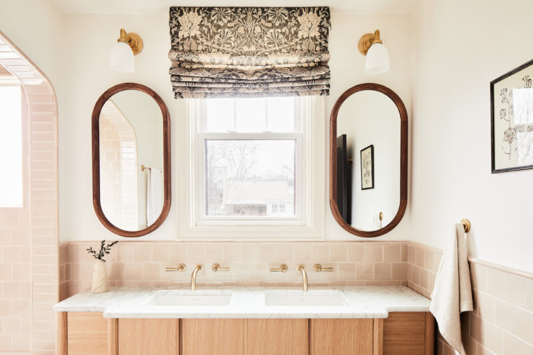 boho bathroom with wood cabinets