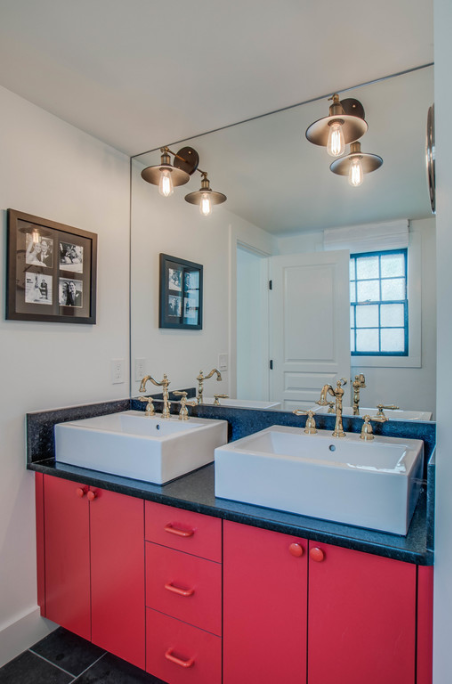 Bathroom with red cabinets and gold sink handles