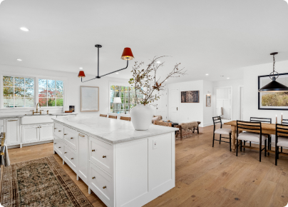 Open-concept kitchen with a large island and adjacent dining area.