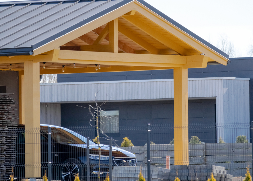 Custom-designed wooden carport providing shaded parking