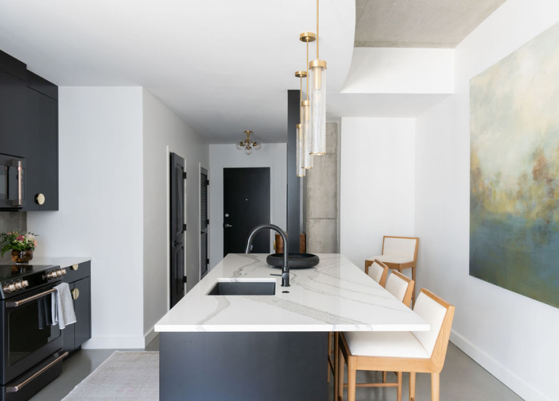 Kitchen with marble countertops and a walk-in pantry addition.
