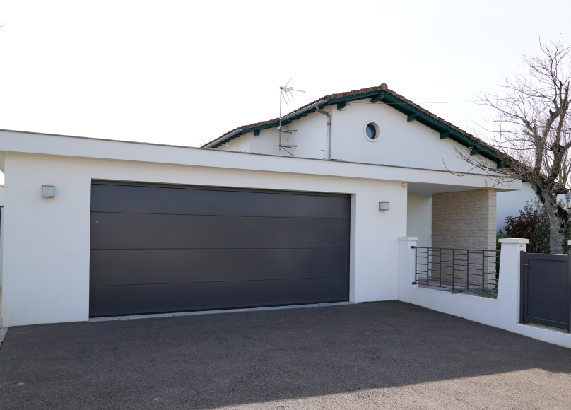 Modern single-car garage attached to a contemporary home.