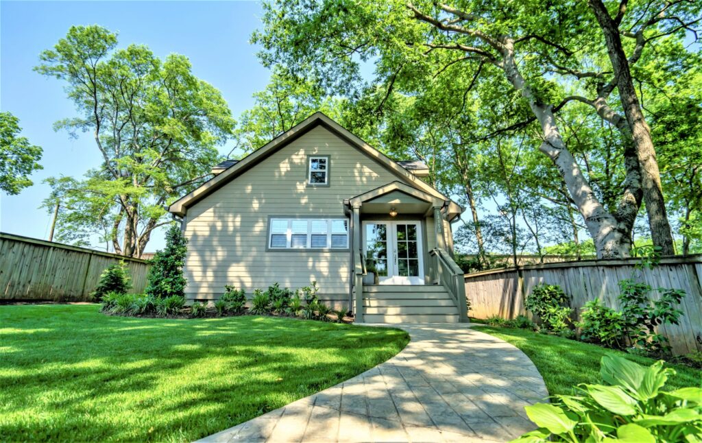 Charming backyard with a small shed and landscaped path.