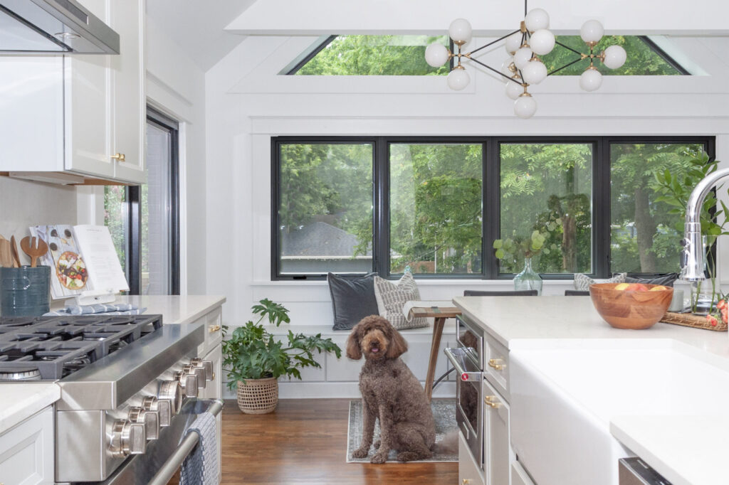 Custom-designed kitchen space with large windows and modern fixtures.